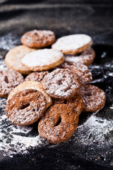 Chocolate chip and oat fresh cookies with sugar powder heap.