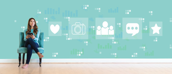 Social media with young woman holding a tablet computer