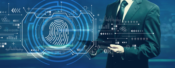 Fingerprint scanning theme with businessman holding a tablet computer