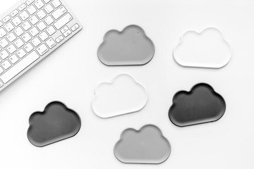 cloud computing concept with clouds and keyboard on white background top view