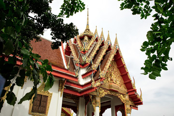 Architectural detail from exterior view of the Buddhist temple in Damnoen Saduak Floating Market near Bangkok, Thailand