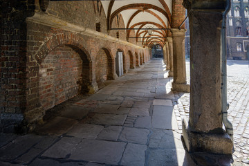 Arcade passage in the backyard of St. Mary's Cathedral (german Marienkirche) and the town hall in the historic old town of Luebeck, a popular tourist destination in northern Germany