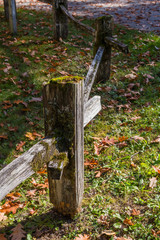 The wooden pole of a fence full of green moss near Concrete, Washington, USA