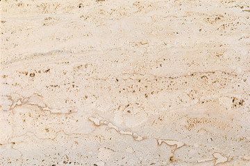 Closeup of beige porous stone textured wall. Neutral beige nature background for design and skins. - obrazy, fototapety, plakaty