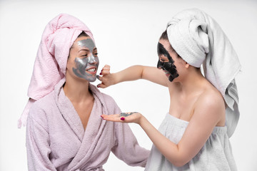 Lesbians have fun in the process of facial cosmetic procedures. Indulge, embrace, tease each other...