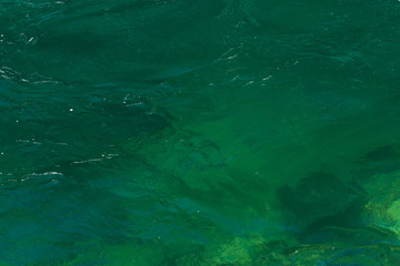 Detail of the turquoise water of the Skagit River and the rocks under it