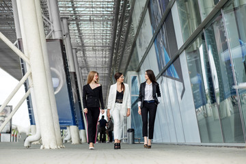 Three people discuss the plan. Concept for business, marketing, finance, work, planning, team and lifestyle