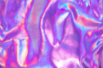 Abstract trendy holographic background. Real texture in violet, pink and mint colors with scratches...