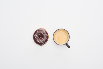 top view of tasty glazed chocolate doughnut and cup of coffee on white background