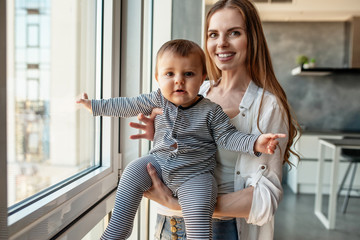 Little child smiling and happy with mom