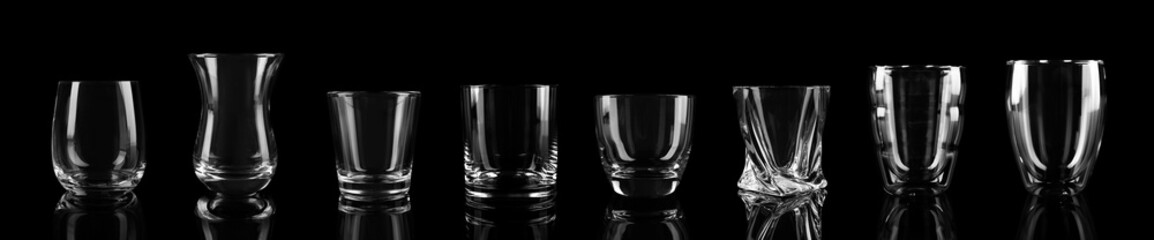 Set of different empty glasses on black background. Banner design