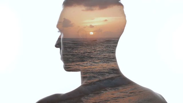 Double exposure of man and beautiful oceanic sunset. Double exposition of man and sea waves