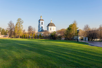 Fototapeta na wymiar Summer landscape, view of the Orthodox church in the Tsaritsyno reserve museum in the early morning