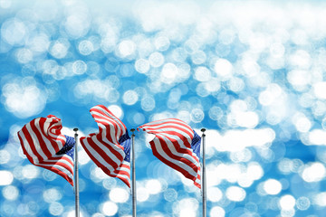 Conceptual image of waving American flags in a row over abstract lights