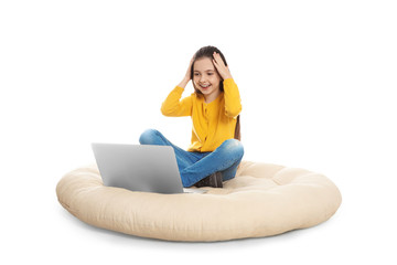 Little girl using video chat on laptop, white background