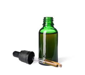 Cosmetic bottle and pipette with essential oil on white background