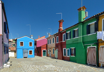 Fototapeta na wymiar A backyard with colorful houses in Burano Island, Venice, Italy.
