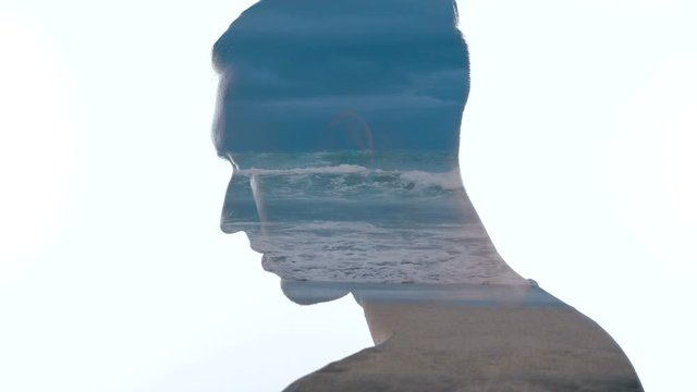 Portrait of pensive man and sea waves - Double exposition