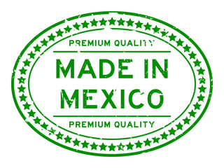 Grunge green premium quality made in Mexico oval rubber seal stamp on white background