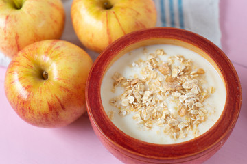 Healthy breakfast with apple yogurt and oat