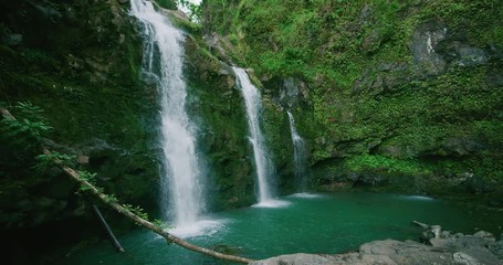 Amazing waterfall in the jungle, three waterfalls flowing in slow motion, jungle adventure vacation