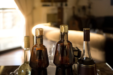 Obraz na płótnie Canvas Bottles of drinks in a room with luxury decor