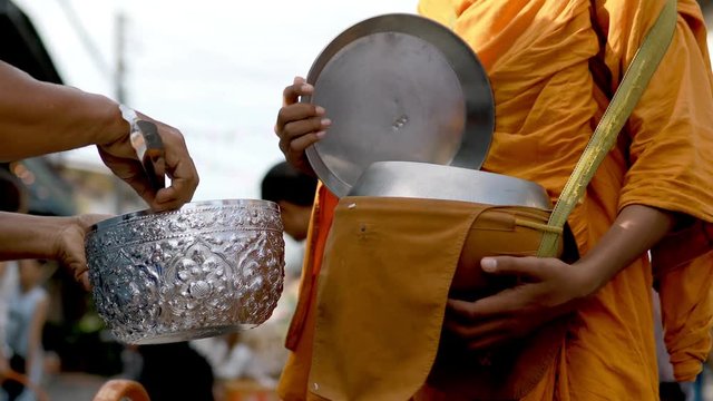 offering food to thai monk early morning