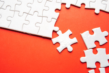 pieces of blank jigsaw puzzle for copy space, replacement words or text. Close up selective focus.