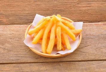 French Fries isolated on wooden background