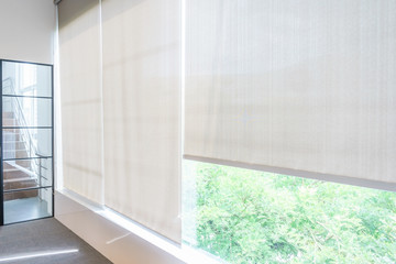 Roll Blinds on the windows, the sun does not penetrate the house. Window in the Interior Roller Blinds. Beautiful Blinds on the Window - obrazy, fototapety, plakaty