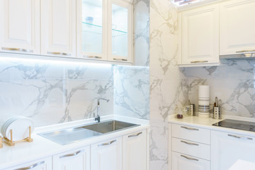 Fototapeta na wymiar Bright modern kitchen with stainless steel appliances. Interior design.