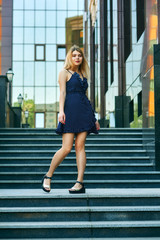 Young girl in summer dress on the streets of European cities