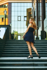 Young girl in summer dress on the streets of European cities