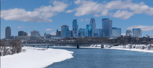 Partially Frozen Mississippi River and Minneapolis Downtown during Winter