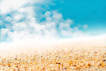 Fototapeta na wymiar Tropical nature clean beach and white sand in summer with sun light blue sky and bokeh background.