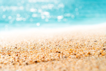 Tropical nature clean beach and white sand in summer with sun light blue sky and bokeh background.