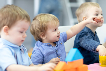 Nursery kids on lesson in preschool or daycare or kindergarten