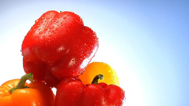 Yellow, Orange And Red Peppers Rotate In Frame