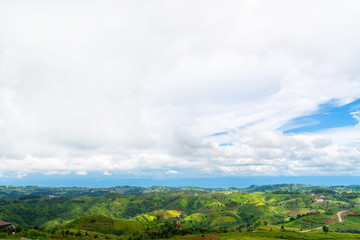 Blue sky high peak mountains fog hills mist scenery national park views at Phu Tub Berk, Khao Koh, Phetchabun Province, Thailand