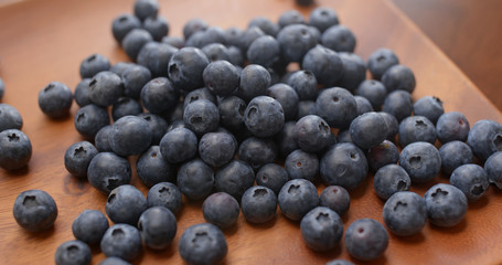 Stack of blueberry on the wooden plate