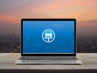 Service fix car with wrench tool flat icon on modern laptop computer on wooden table over blur of cityscape on warm light sundown, Business repair car service online concept