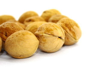 Raw walnut close-up on white background
