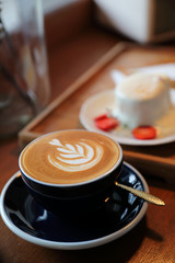 Cappuccino coffee break on wood background