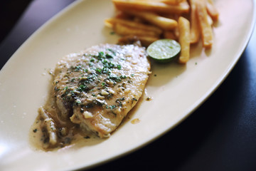Halibut fillet steak with chips