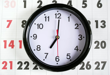 Obraz na płótnie Canvas カレンダーと7時の時計