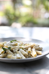 Penne pasta with white sauce and truffle , italian food