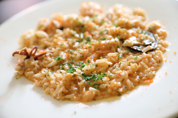 Seafood Risotto , traditional italian rice on table