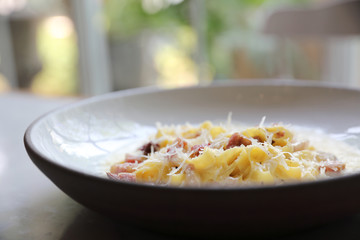 fettuccine carbonara , fettuccine pasta spaghetti with bacon ham and mushroon in white sauce italian food