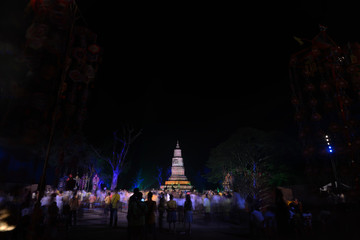 Fototapeta na wymiar Crowd people at Buddhist pagoda in a Buddhist ceremony 