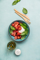 Caprese salad on blue background